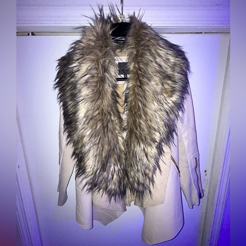 Woman’s sofisticated coat fur comes off and on polyester